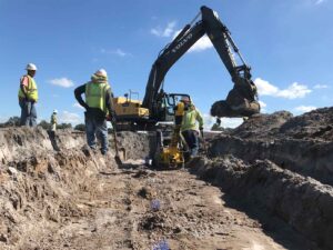 A bulldozer digging a trench in the construction zone